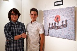 Pictured are Blake Wonnacott and Rhys Johnson with an image from the exhibition.